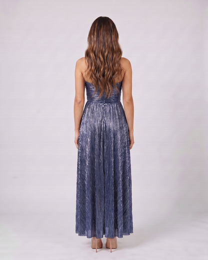 Back view of blue strapless twist front keyhole maxi dress showing solid back