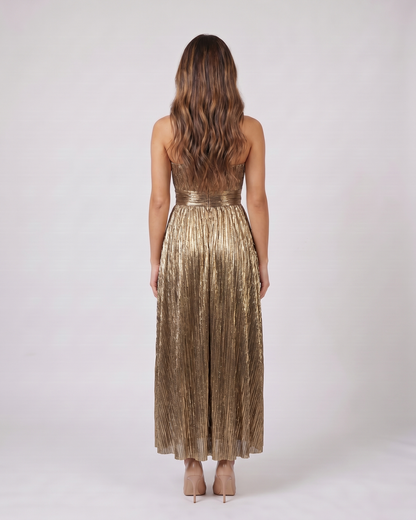 Back view of gold strapless twist front keyhole maxi dress showing solid back