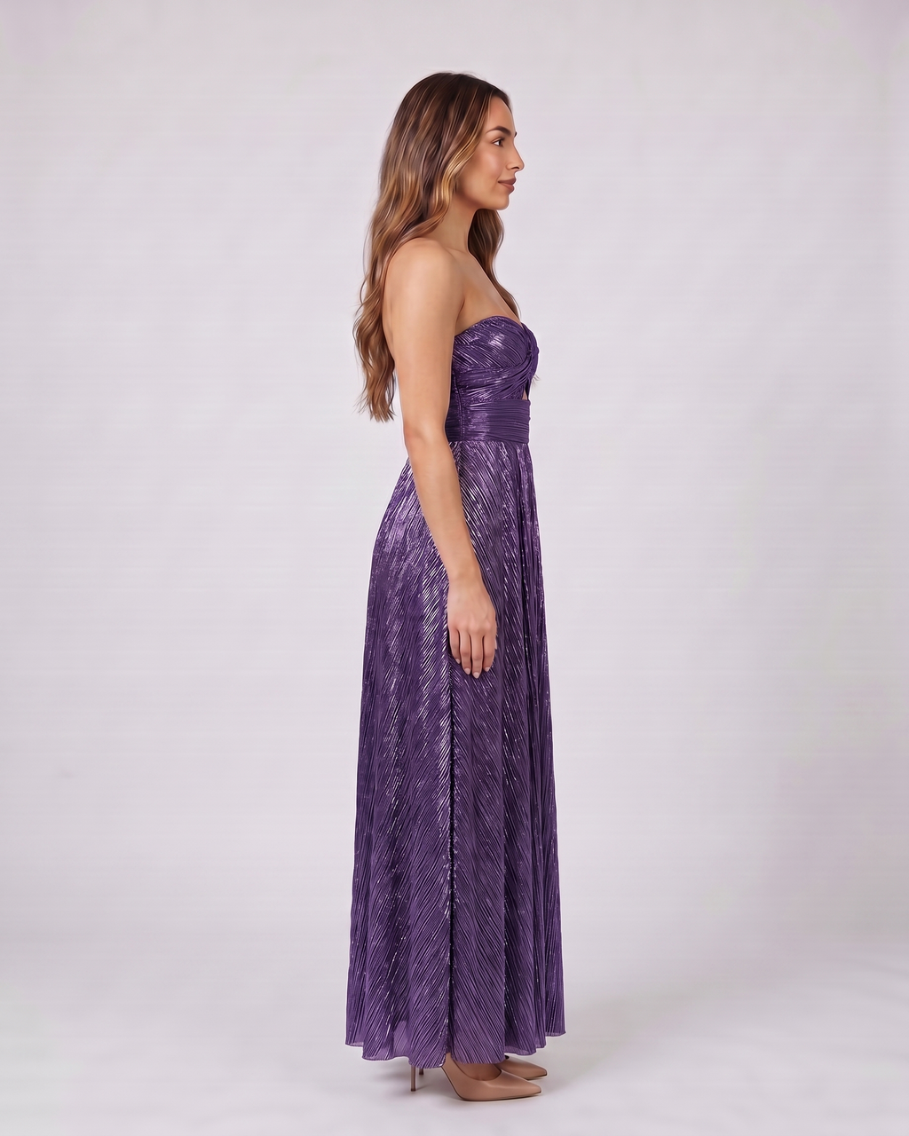 Side view of violet strapless twist front keyhole maxi dress