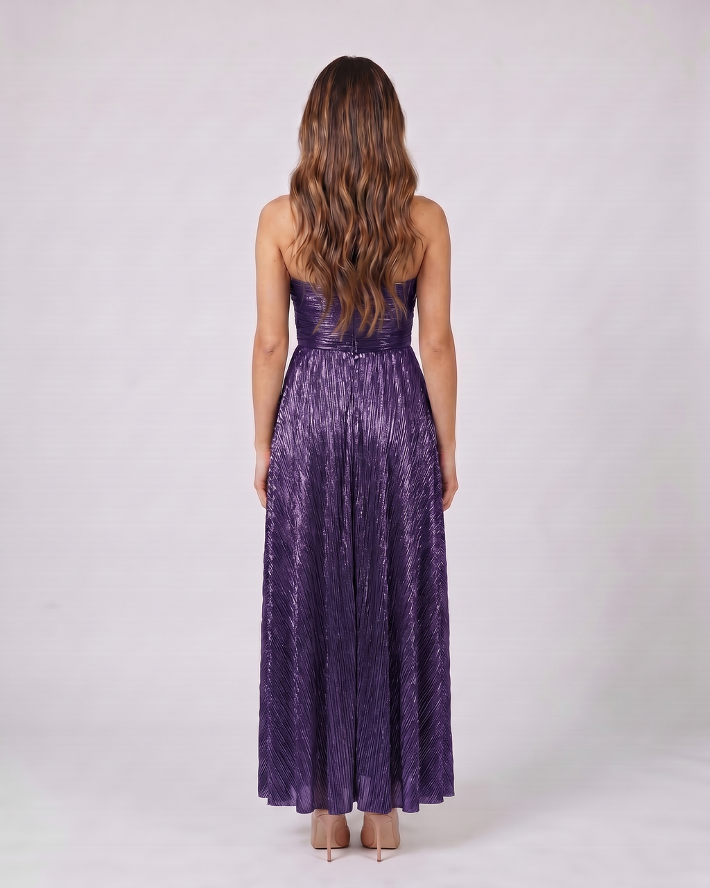 Back view of violet strapless twist front keyhole maxi dress showing solid back