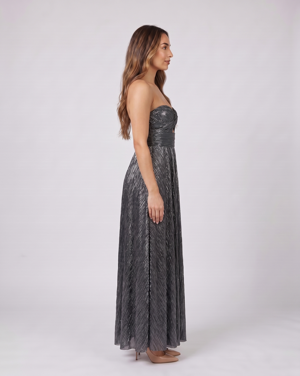 Side view of black strapless twist front keyhole maxi dress