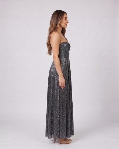 Side view of black strapless twist front keyhole maxi dress