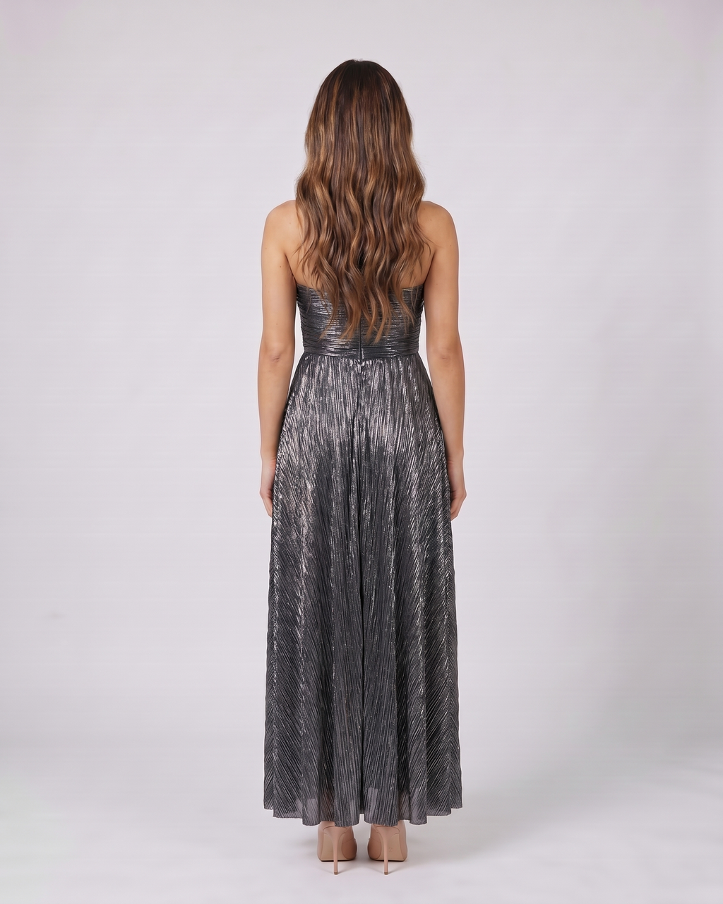 Back view of black strapless twist front keyhole maxi dress showing solid back