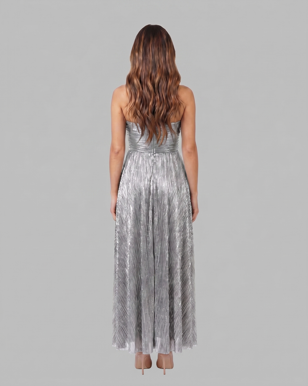 Back view of silver strapless twist front keyhole maxi dress showing solid back