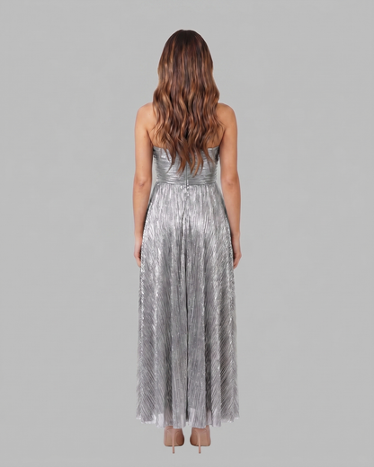 Back view of silver strapless twist front keyhole maxi dress showing solid back