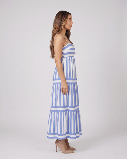 Side view of blue striped spaghetti strap maxi dress