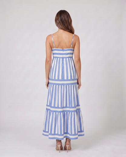 Back view of blue striped spaghetti strap maxi dress showing solid back with invisible zipper closure
