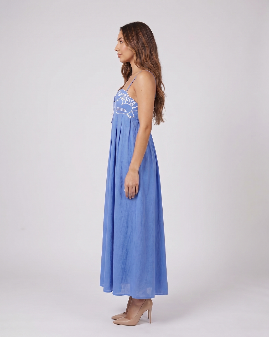Side view of blue sweetheart fish print maxi dress