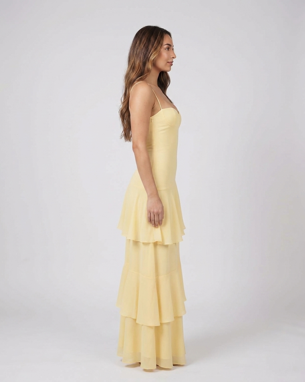 Side view of yellow sweetheart spaghetti strap tiered maxi dress