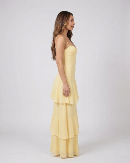 Side view of yellow sweetheart spaghetti strap tiered maxi dress
