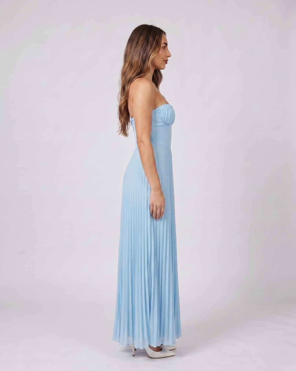 Side view of sky blue sweetheart strapless pleated maxi dress