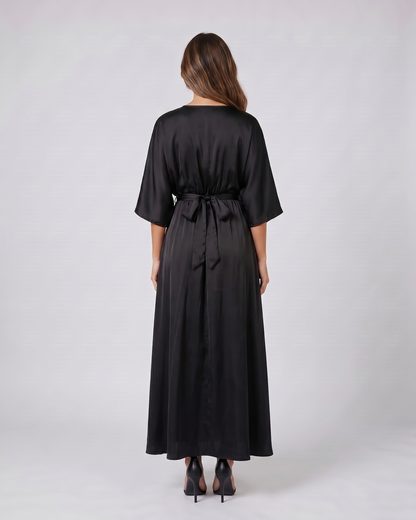 Back view of black v neck batwing sleeve maxi dress showing solid back