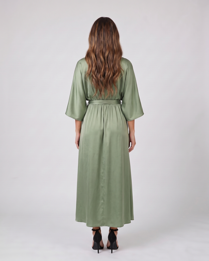 Back view of green v neck batwing sleeve maxi dress showing solid back