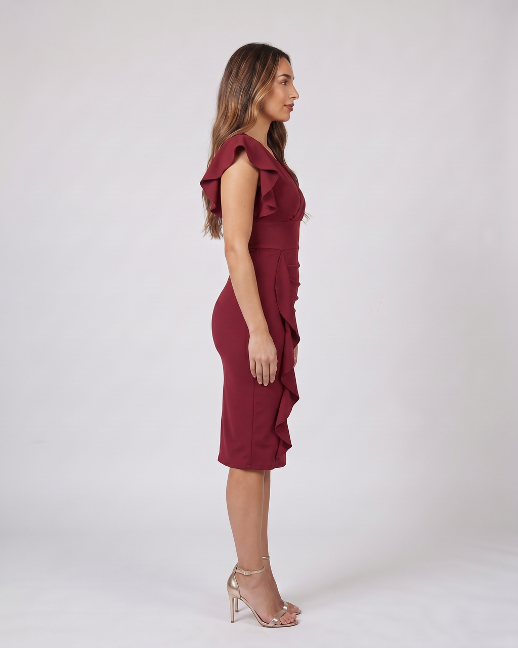 Side view of burgundy v neck flutter sleeve ruched midi dress