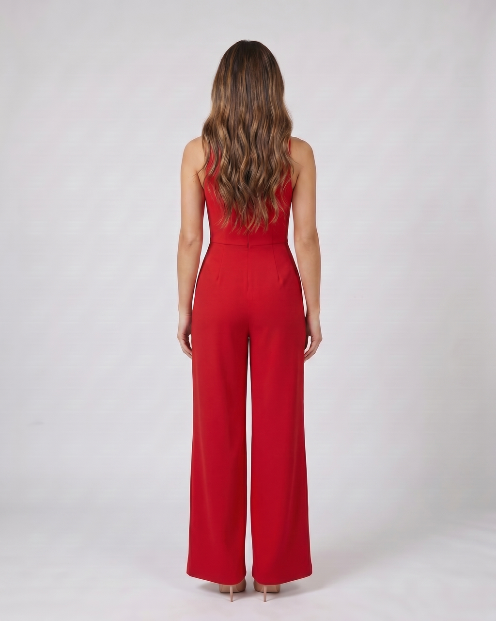 Back view of red v neck flutter sleeve wide leg jumpsuit showing solid back