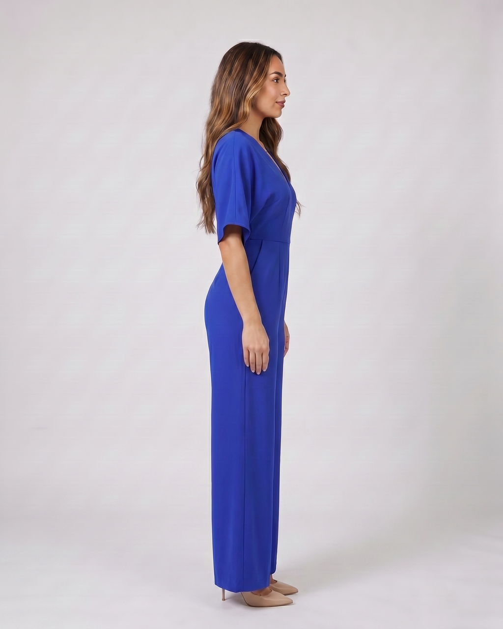 Side view of blue v neck flutter sleeve wide leg jumpsuit