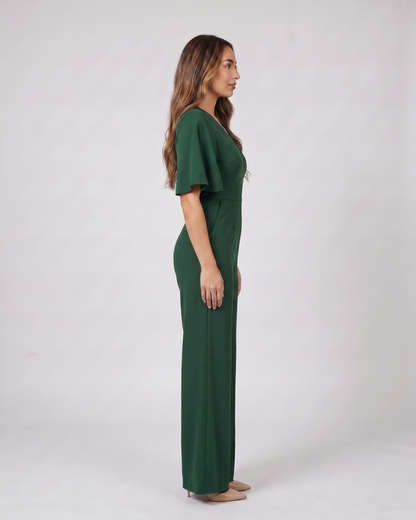 Side view of green v neck flutter sleeve wide leg jumpsuit