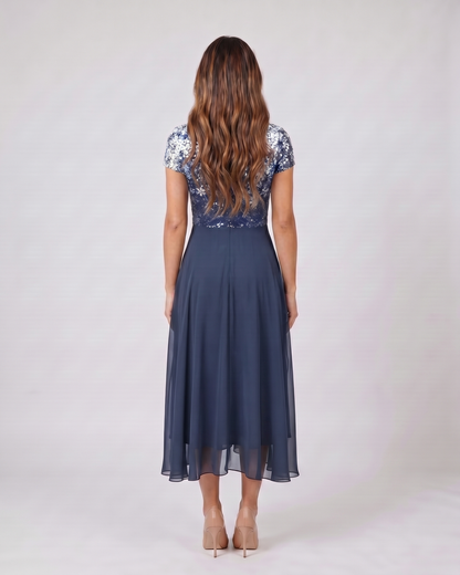 Back view of blue v neck short sleeve ombre midi dress showing solid back
