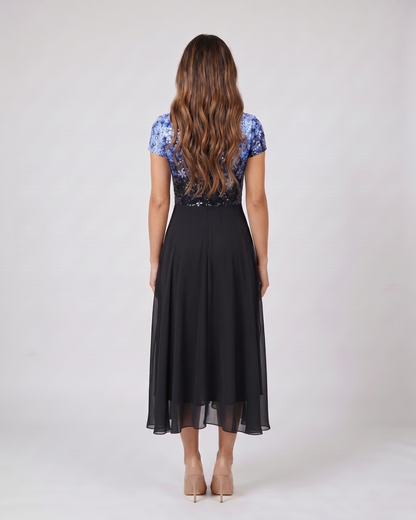Back view of blue / black v neck short sleeve ombre midi dress showing solid back
