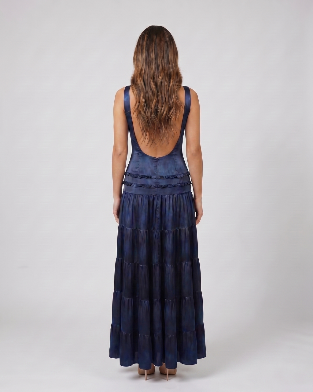 Back view of blue v neck spaghetti strap open back tiered maxi dress showing deep U-shaped open back with wide shoulder straps
