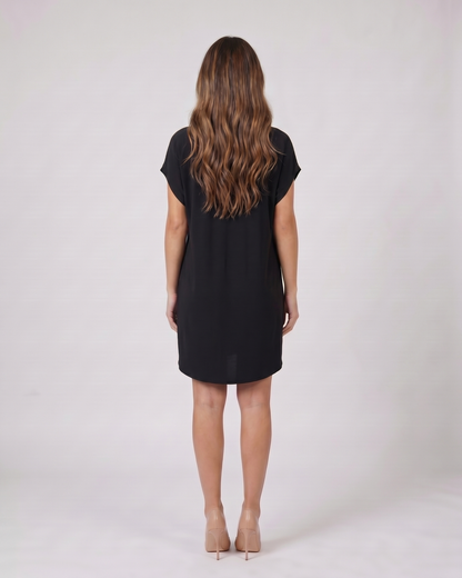 Back view of black v neck split sleeve mini dress showing solid back