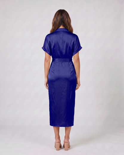 Back view of dark blue wedding guest collared v neck midi dress showing solid back