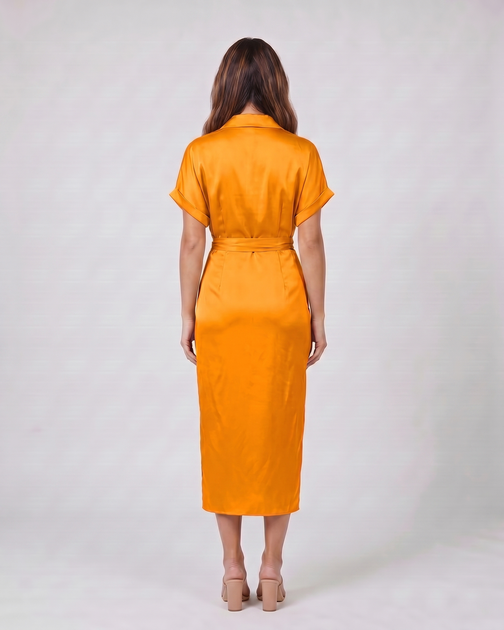 Back view of orange wedding guest collared v neck midi dress showing solid back