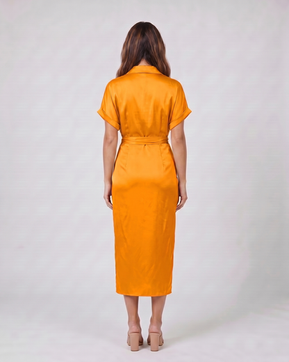 Back view of orange wedding guest collared v neck midi dress showing solid back