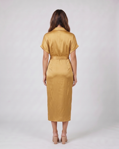 Back view of gold wedding guest collared v neck midi dress showing solid back