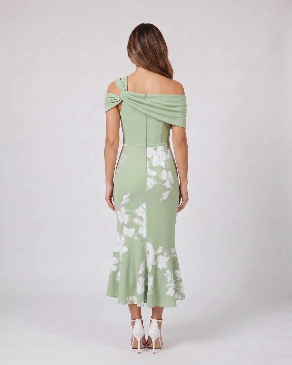 Back view of green wedding guest floral off shoulder midi dress showing solid back with zipper closure