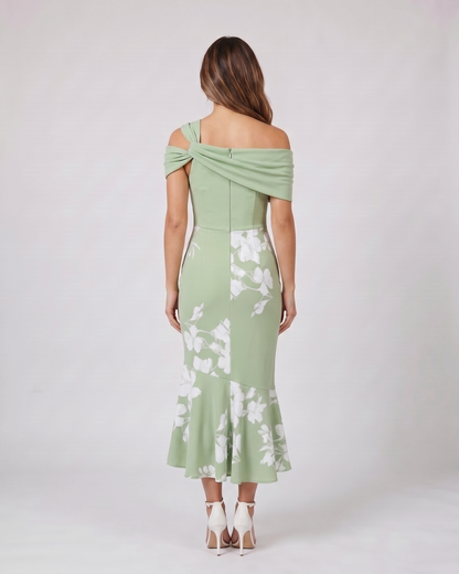 Back view of green wedding guest floral off shoulder midi dress showing solid back with zipper closure