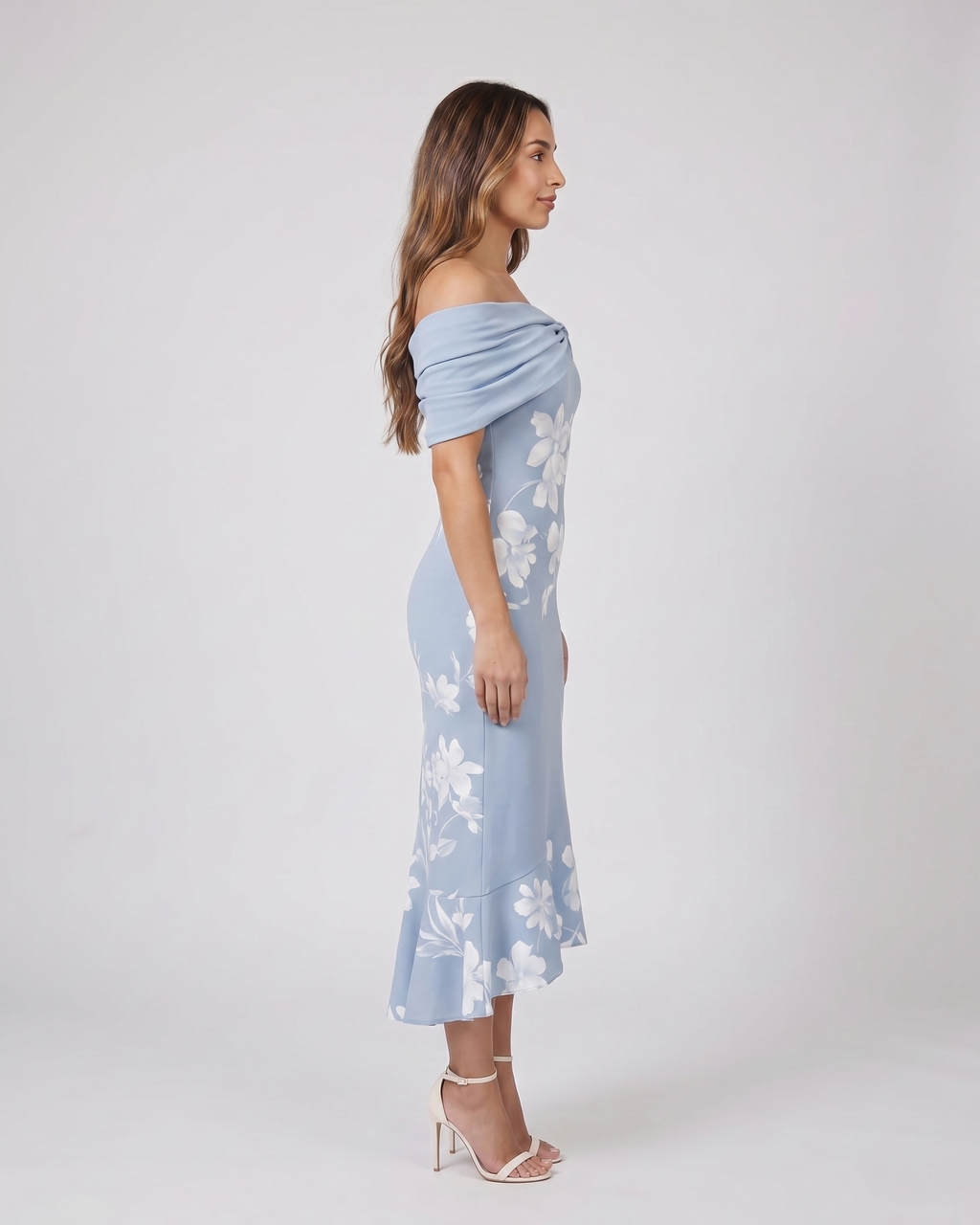 Side view of blue wedding guest floral off shoulder midi dress