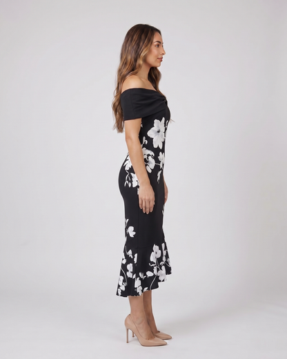 Side view of black wedding guest floral off shoulder midi dress