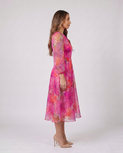 Side view of pink wedding guest floral puff sleeve midi dress