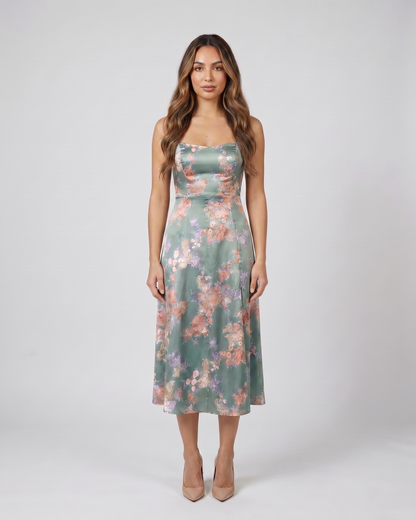 Back view of green wedding guest floral tie front midi dress showing solid back with concealed zipper closure