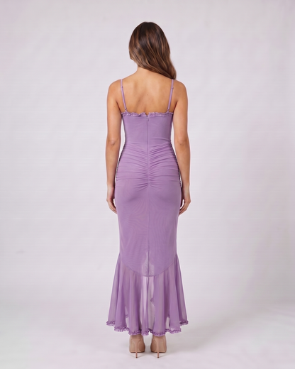 Back view of purple wedding guest ruched sweetheart maxi dress showing solid back with center zipper closure