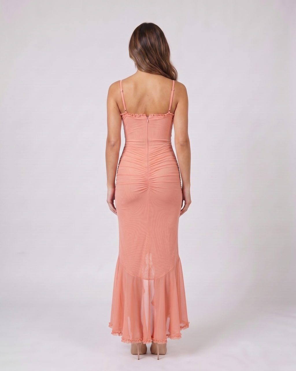 Back view of pink wedding guest ruched sweetheart maxi dress showing solid back with center zipper closure