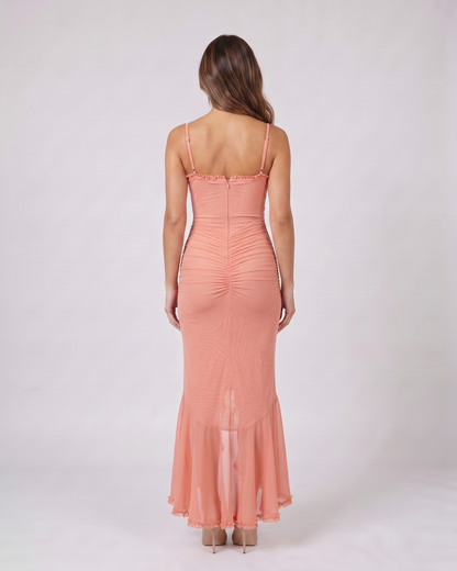 Back view of pink wedding guest ruched sweetheart maxi dress showing solid back with center zipper closure
