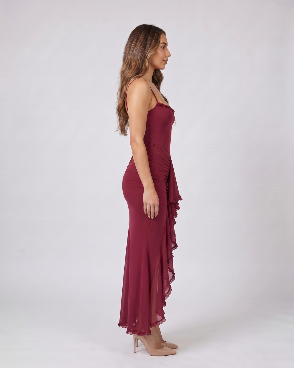 Side view of burgundy wedding guest ruched sweetheart maxi dress