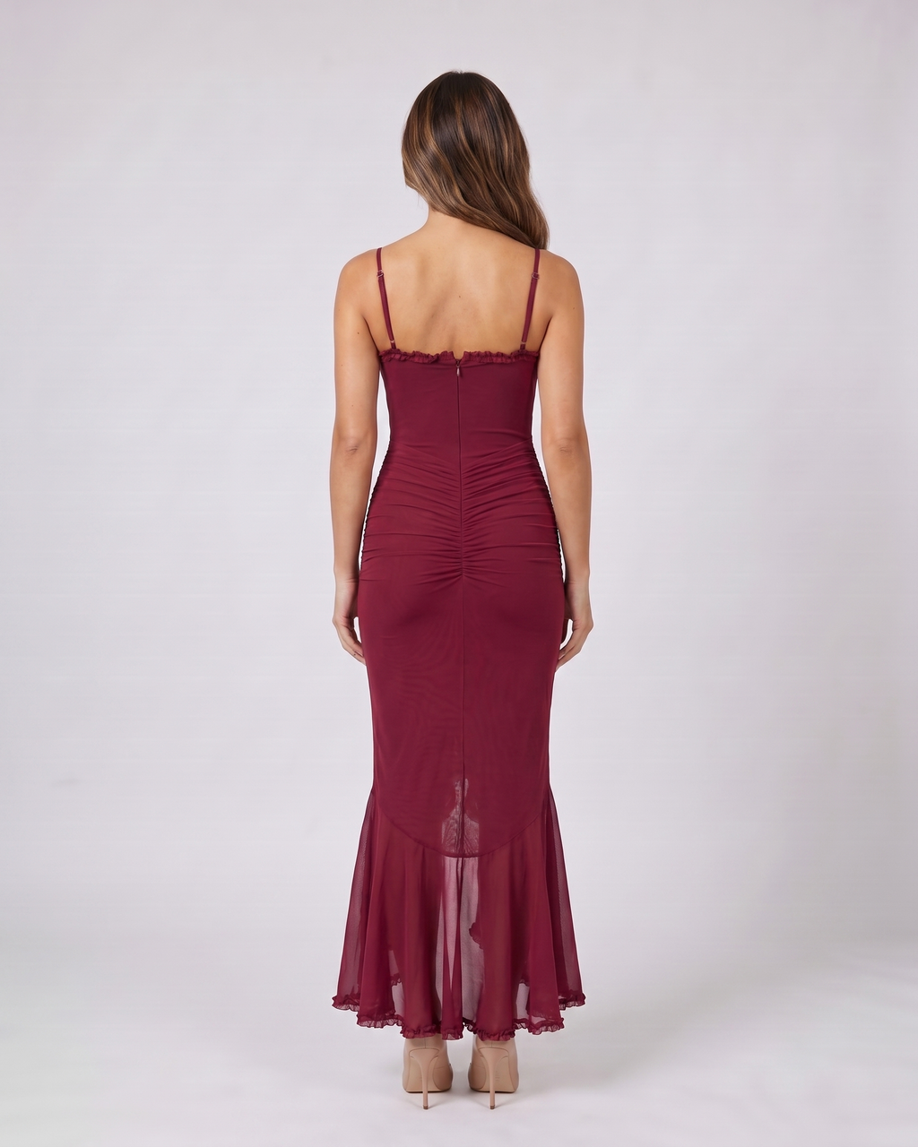 Back view of burgundy wedding guest ruched sweetheart maxi dress showing solid back with center zipper closure