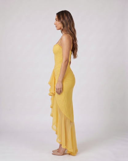 Side view of yellow wedding guest ruched sweetheart maxi dress