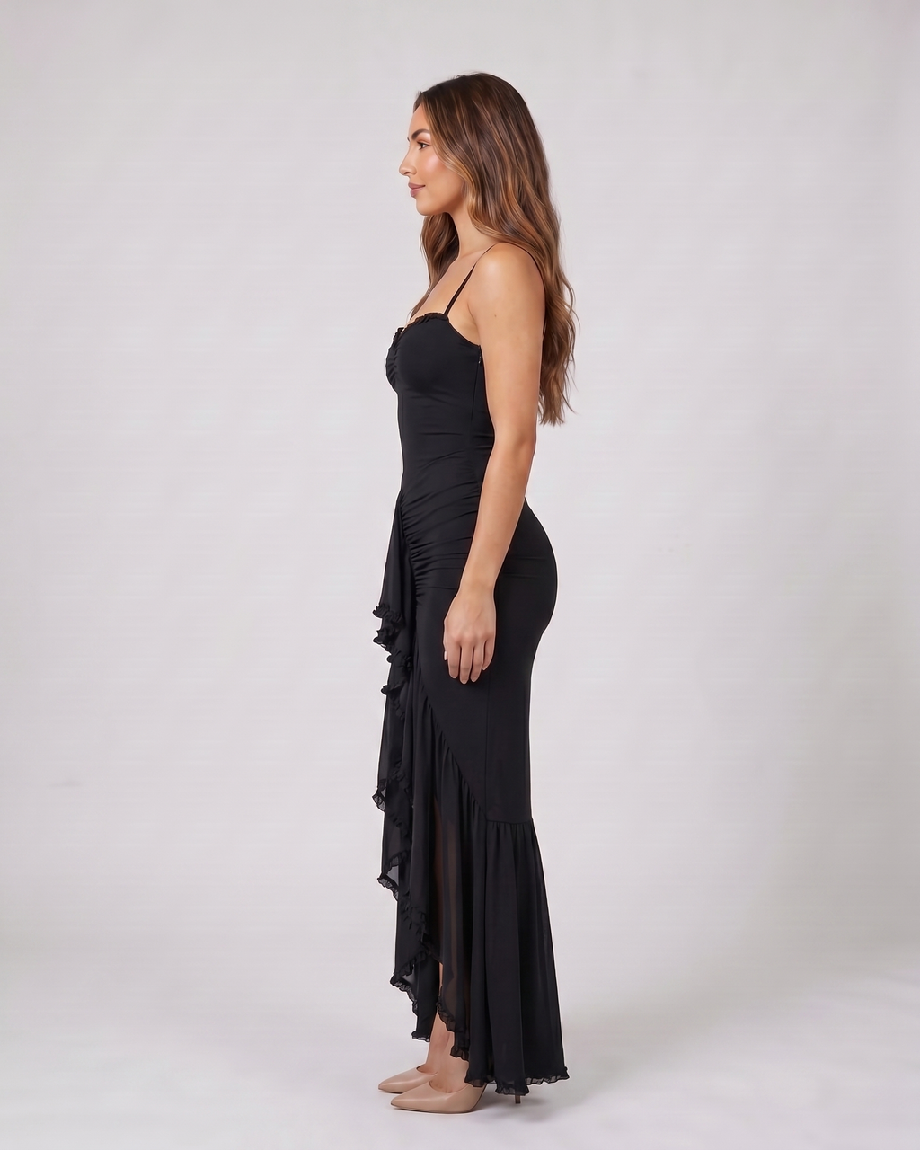 Side view of black wedding guest ruched sweetheart maxi dress