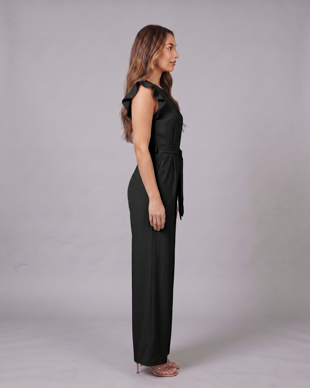 Side view of black wedding guest ruffle sleeve wide leg jumpsuit