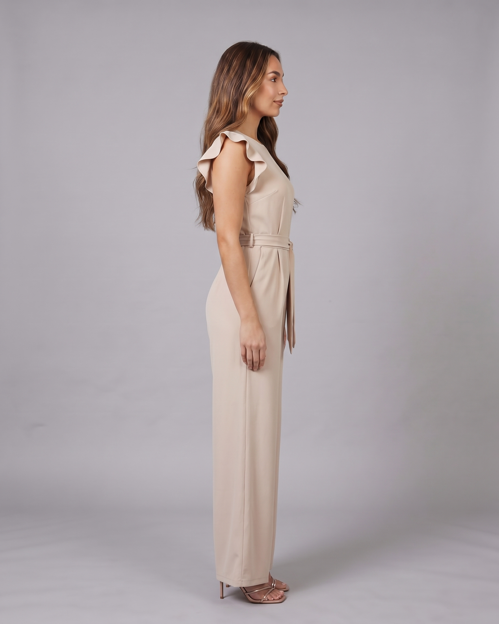 Side view of beige wedding guest ruffle sleeve wide leg jumpsuit