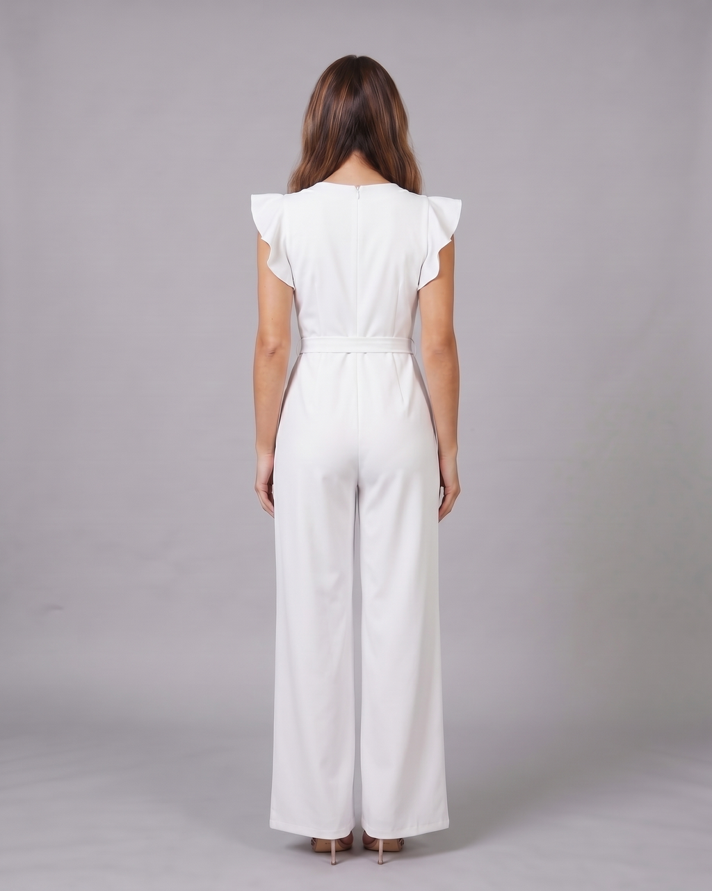 Back view of white wedding guest ruffle sleeve wide leg jumpsuit showing solid back with invisible zipper closure