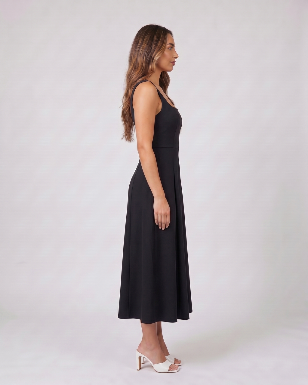 Side view of black wedding guest square neck midi dress