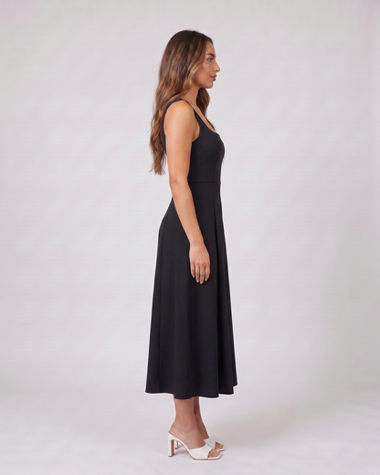 Side view of black wedding guest square neck midi dress