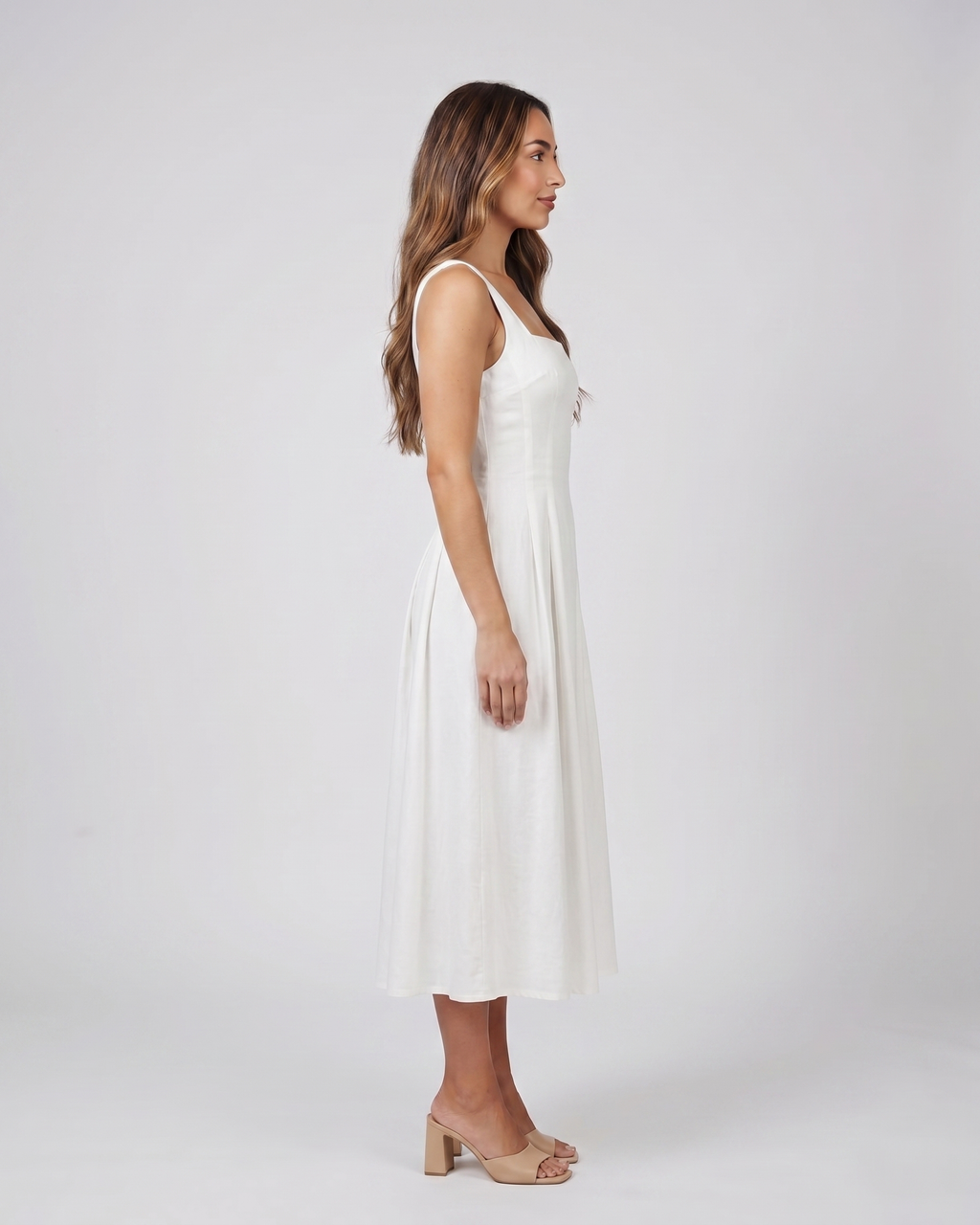 Side view of white wedding guest square neck midi dress