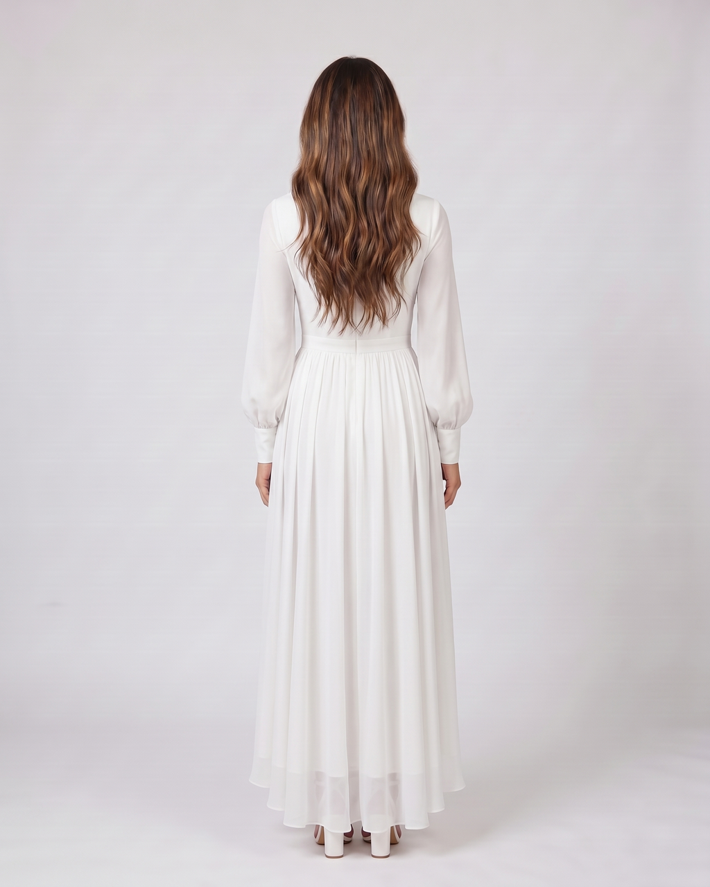 Back view of white wedding guest v neck long sleeve maxi dress showing solid back
