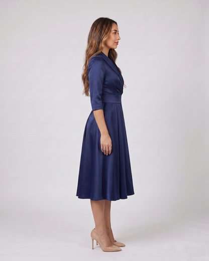 Side view of navy wrap v neck 3/4 sleeve with pockets midi dress